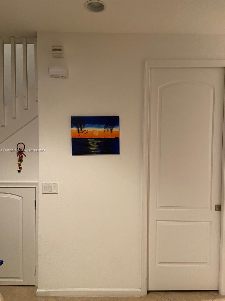 7765 Paddock Place, Unit 7765 Davie, FL 33328 - Photo 22 of 40 a hallway with closet