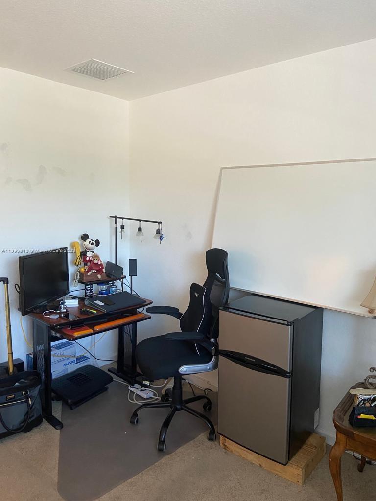 7765 Paddock Place, Unit 7765 Davie, FL 33328 - Photo 25 of 40 a view of a workspace with furniture
