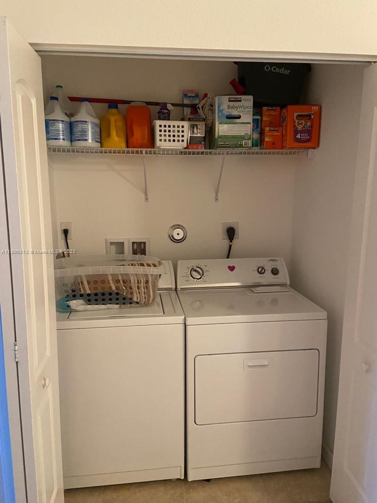 7765 Paddock Place, Unit 7765 Davie, FL 33328 - Photo 28 of 40 a close view of washer and dryer