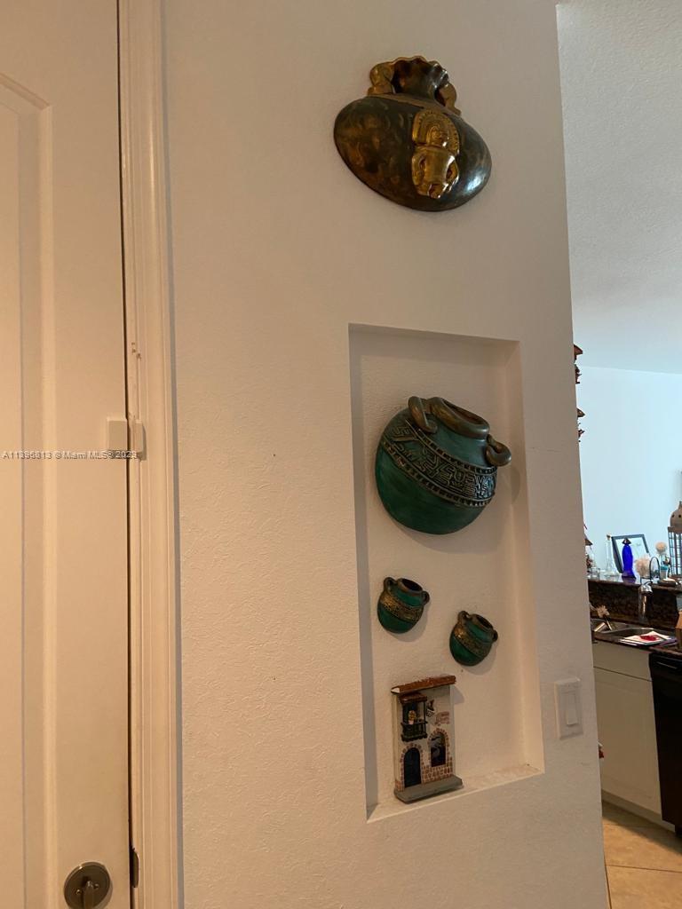 7765 Paddock Place, Unit 7765 Davie, FL 33328 - Photo 5 of 40 a bathroom with a sink and a mirror