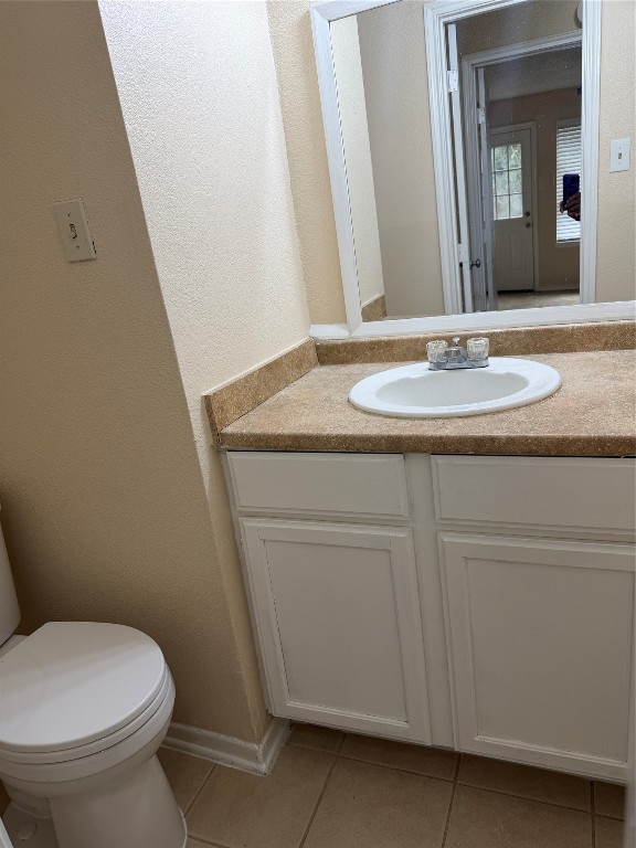 9 Dewthread Court Spring, TX 77380 - Photo 11 of 24 a bathroom with a granite countertop toilet sink and mirror