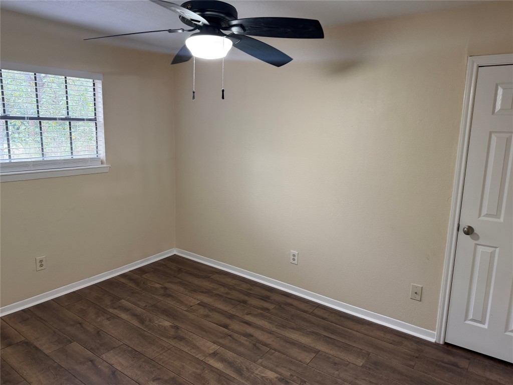 9 Dewthread Court Spring, TX 77380 - Photo 12 of 24 an empty room with wooden floor fan and windows