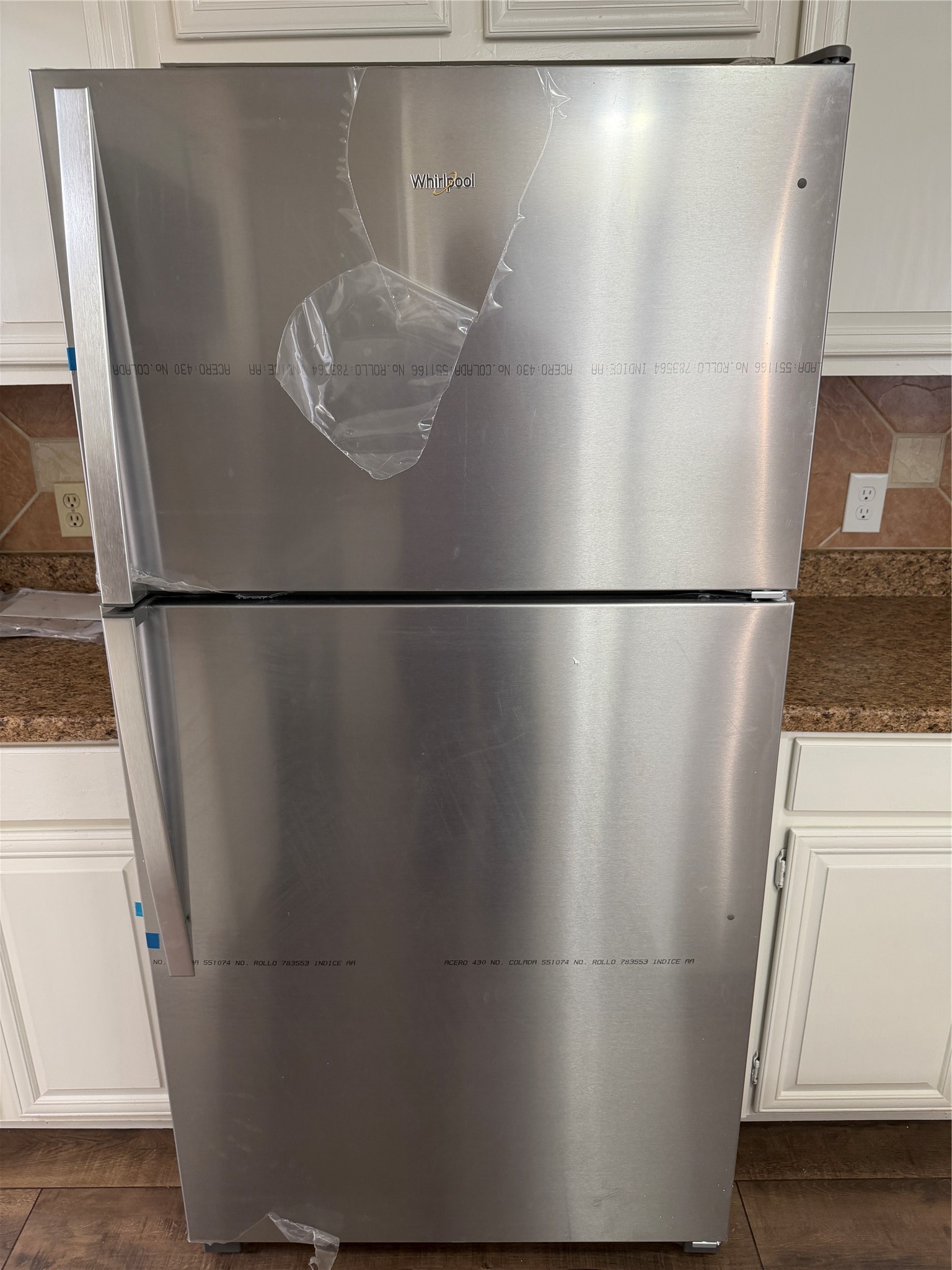 9 Dewthread Court Spring, TX 77380 - Photo 23 of 25 a view of a refrigerator with wooden floor