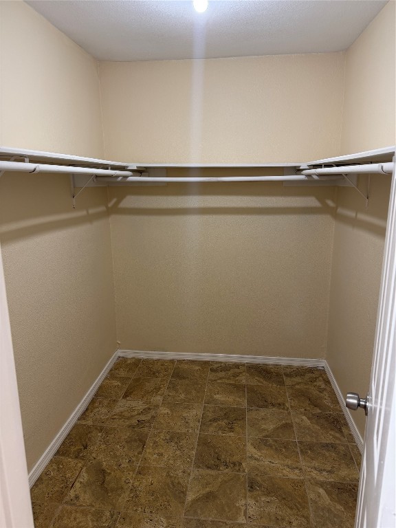 9 Dewthread Court Spring, TX 77380 - Photo 9 of 24 a view of a room with racks on the wall