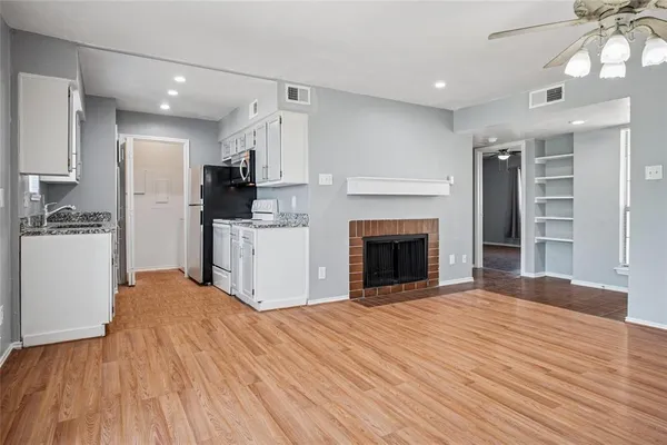 a view of a kitchen with a sink and a kitchen
