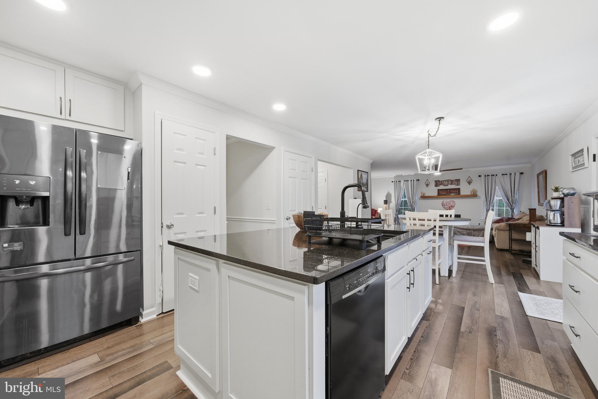 2550 Port Tobacco Road Nanjemoy, MD 20662 - Photo 25 of 70 a kitchen with stainless steel appliances granite countertop a sink stove and refrigerator