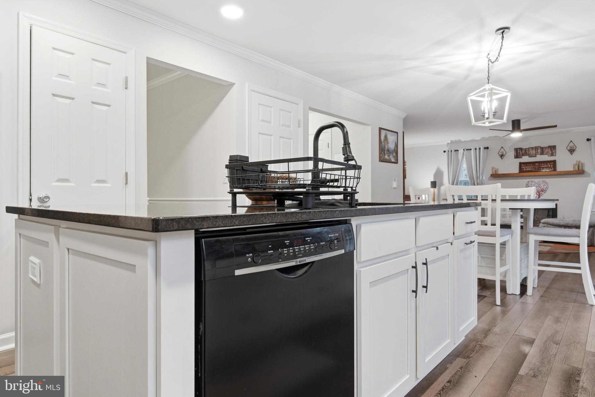 2550 Port Tobacco Road Nanjemoy, MD 20662 - Photo 30 of 70 a kitchen with stainless steel appliances granite countertop a stove and white cabinets