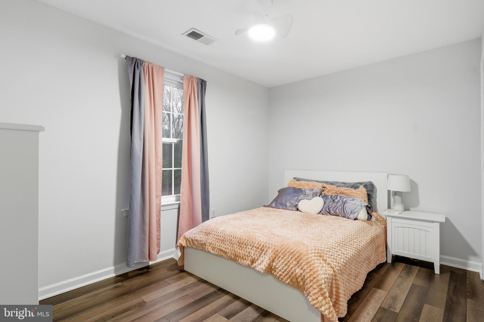2550 Port Tobacco Road Nanjemoy, MD 20662 - Photo 44 of 70 a bedroom with a bed and wooden floor