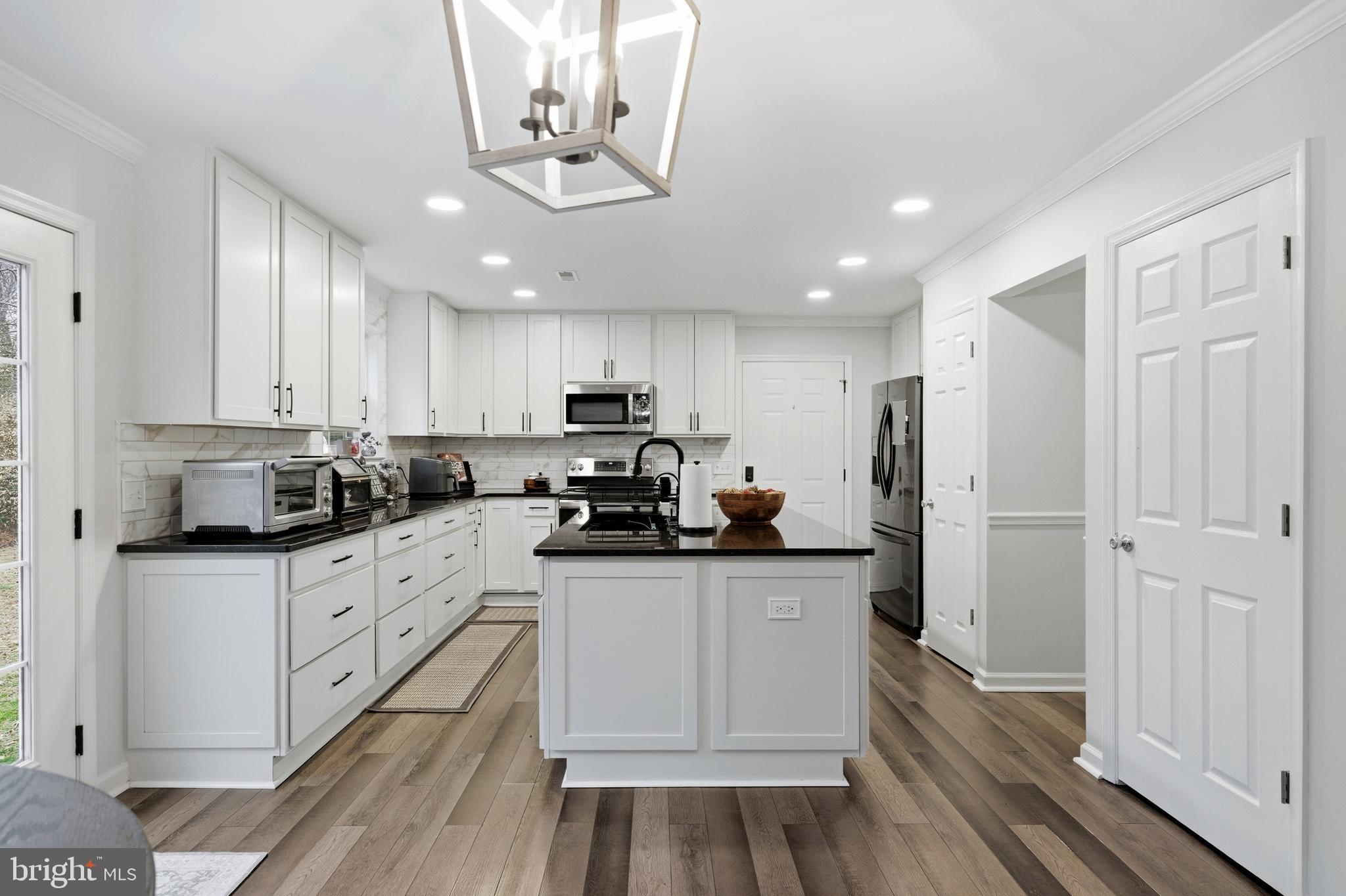 2550 Port Tobacco Road Nanjemoy, MD 20662 - Photo 5 of 70 a kitchen with a sink stainless steel appliances and cabinets