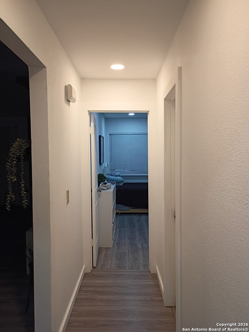 6723 Raintree Path San Antonio, TX 78233 - Photo 3 of 11 a view of a hallway with wooden floor