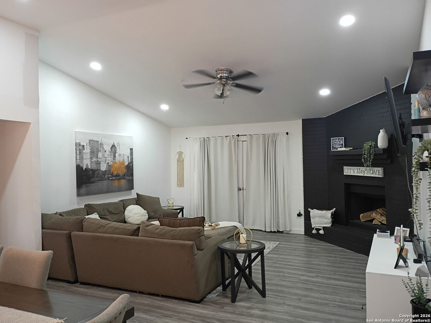 6723 Raintree Path San Antonio, TX 78233 - Photo 4 of 11 a living room with furniture and a flat screen tv