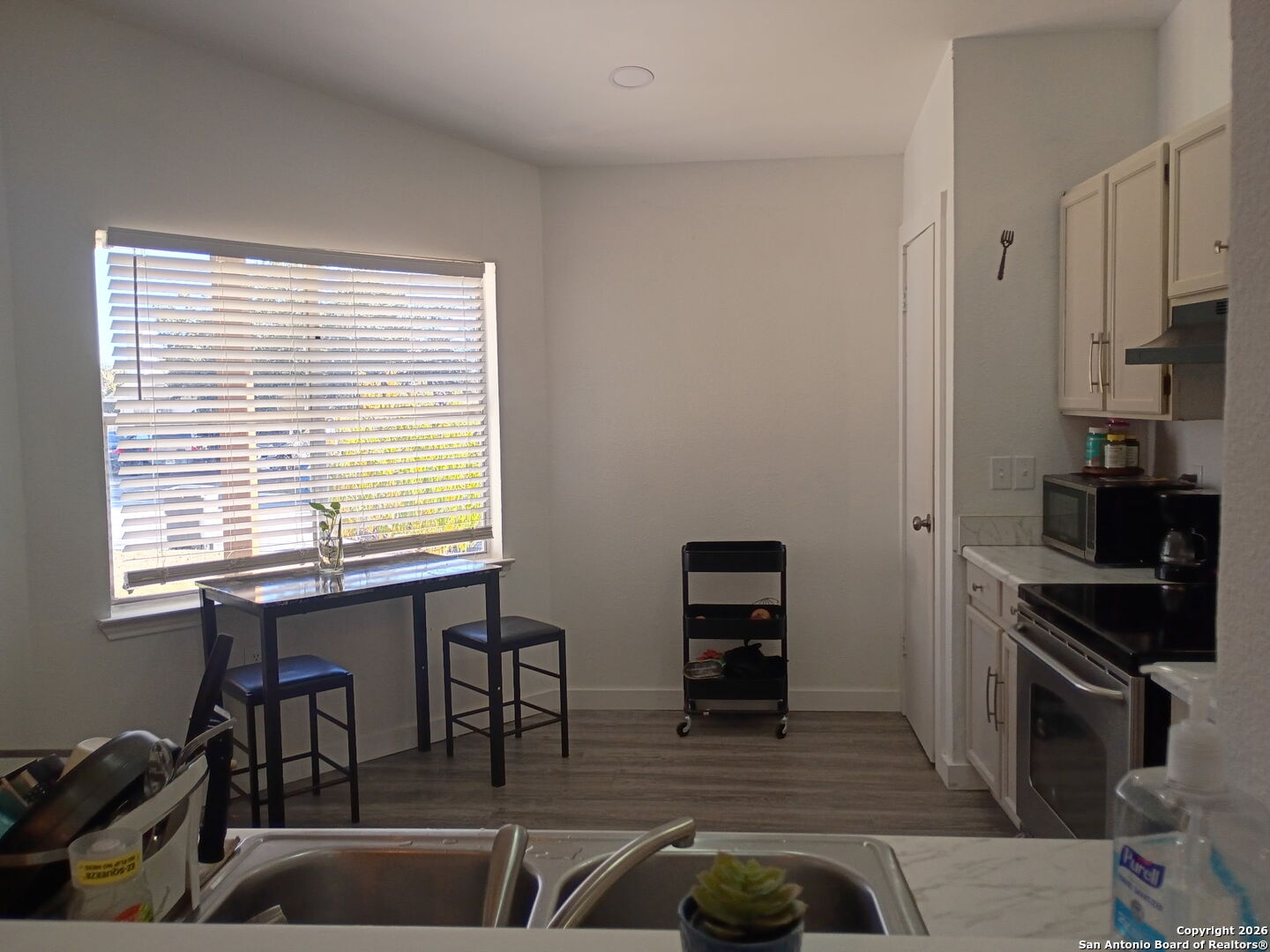 6723 Raintree Path San Antonio, TX 78233 - Photo 6 of 11 a kitchen with stainless steel appliances granite countertop a sink and a stove