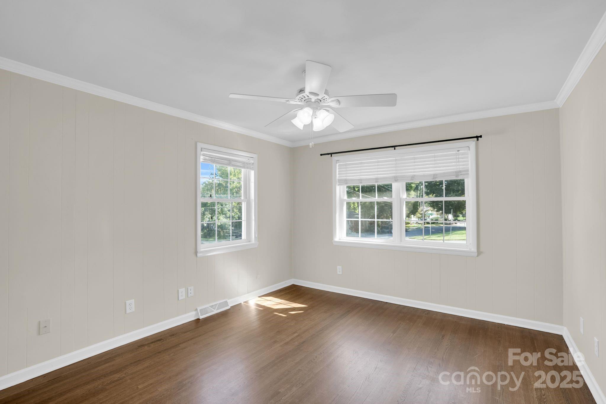 539 Hollis Road Charlotte, NC 28209 - Photo 14 of 23 a view of an empty room with wooden floor and a window