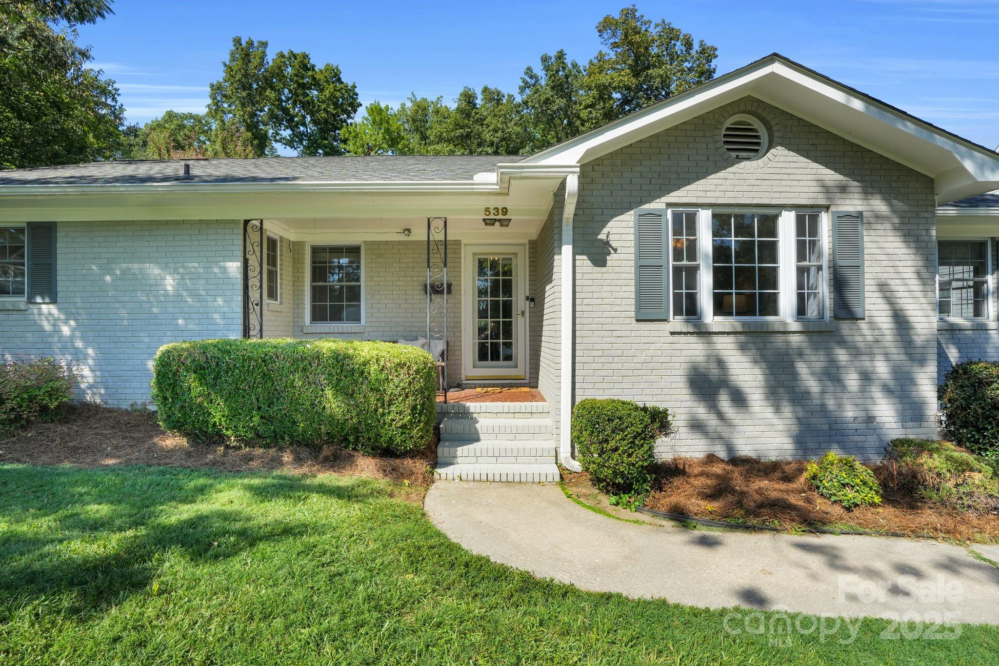 539 Hollis Road Charlotte, NC 28209 - Photo 3 of 23 a front view of a house with garden