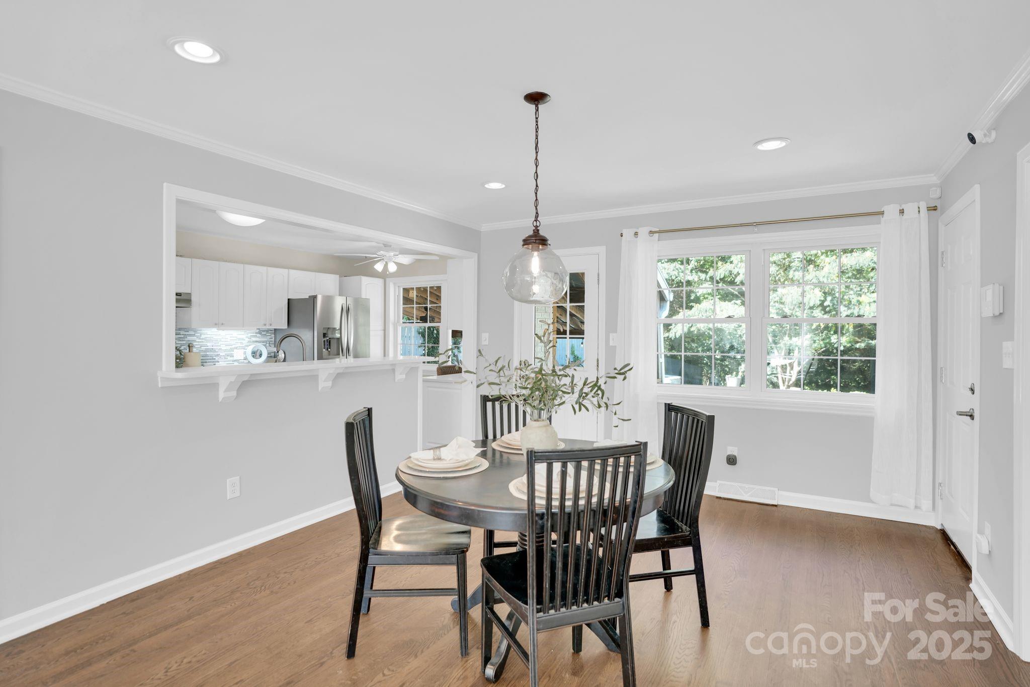 539 Hollis Road Charlotte, NC 28209 - Photo 5 of 23 a dining room with furniture window and wooden floor