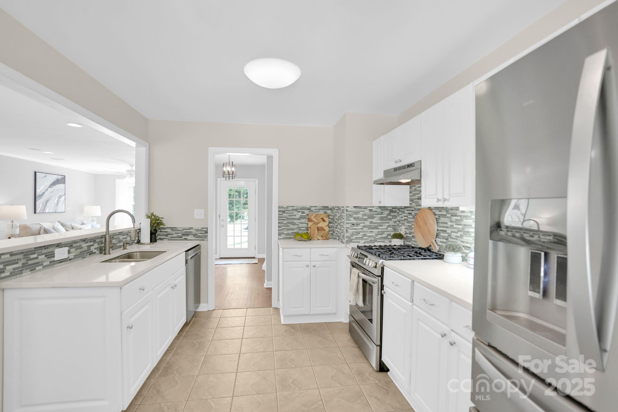 539 Hollis Road Charlotte, NC 28209 - Photo 8 of 23 a kitchen with a stove top oven sink and cabinets