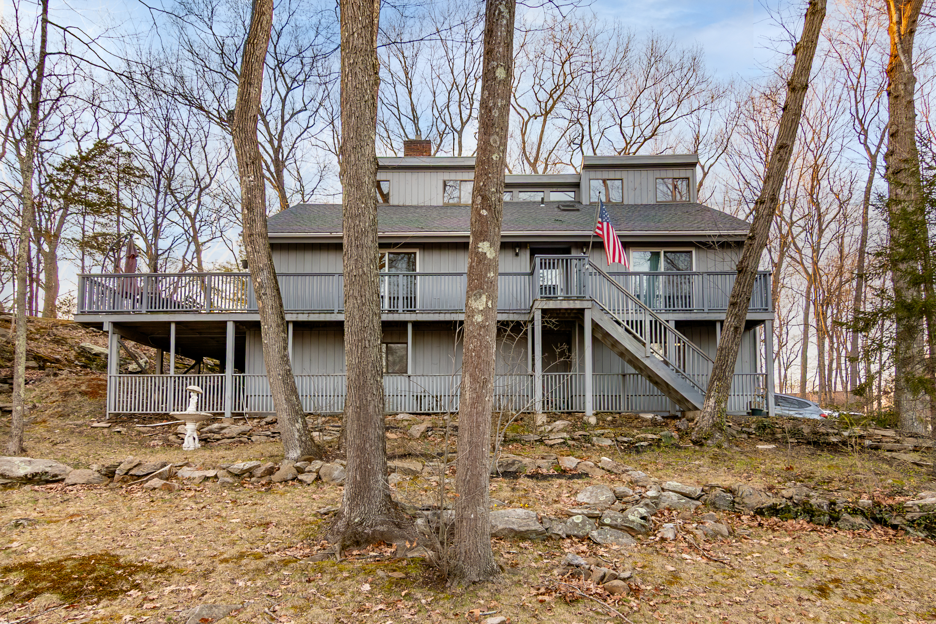 a front view of a house with large windows