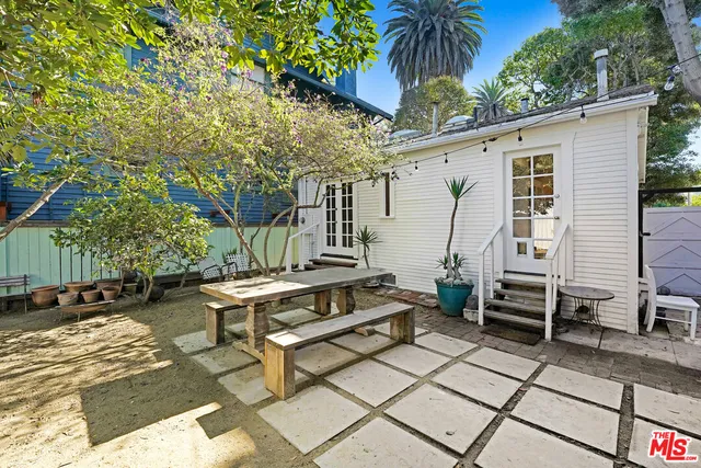 a view of a backyard with sitting area