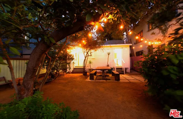 a view of a park with seating space