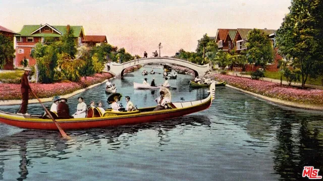 a view of a wooden deck with a house