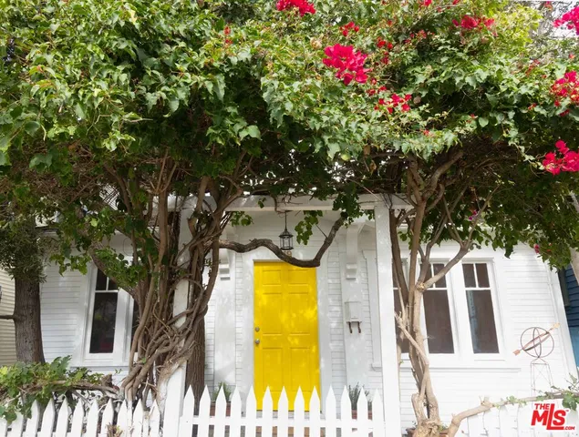 a view of a house with a tree