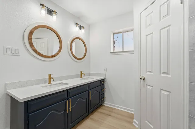 a bathroom with a sink and a mirror