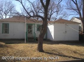 4115 South Hayden Street Amarillo, TX 79110 - Photo 2 of 6 a front view of a house with garden