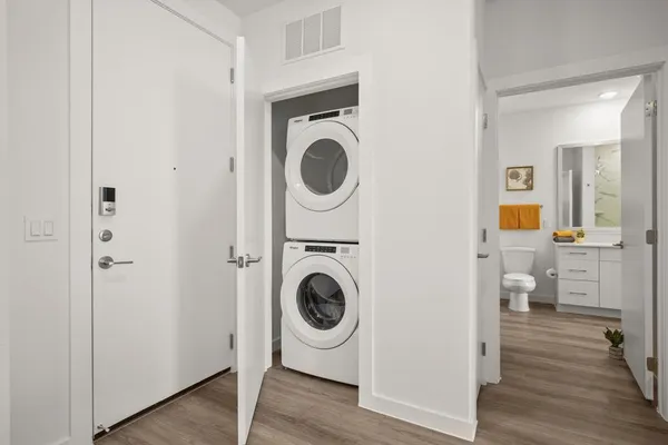 a view of a hallway with washer and dryer