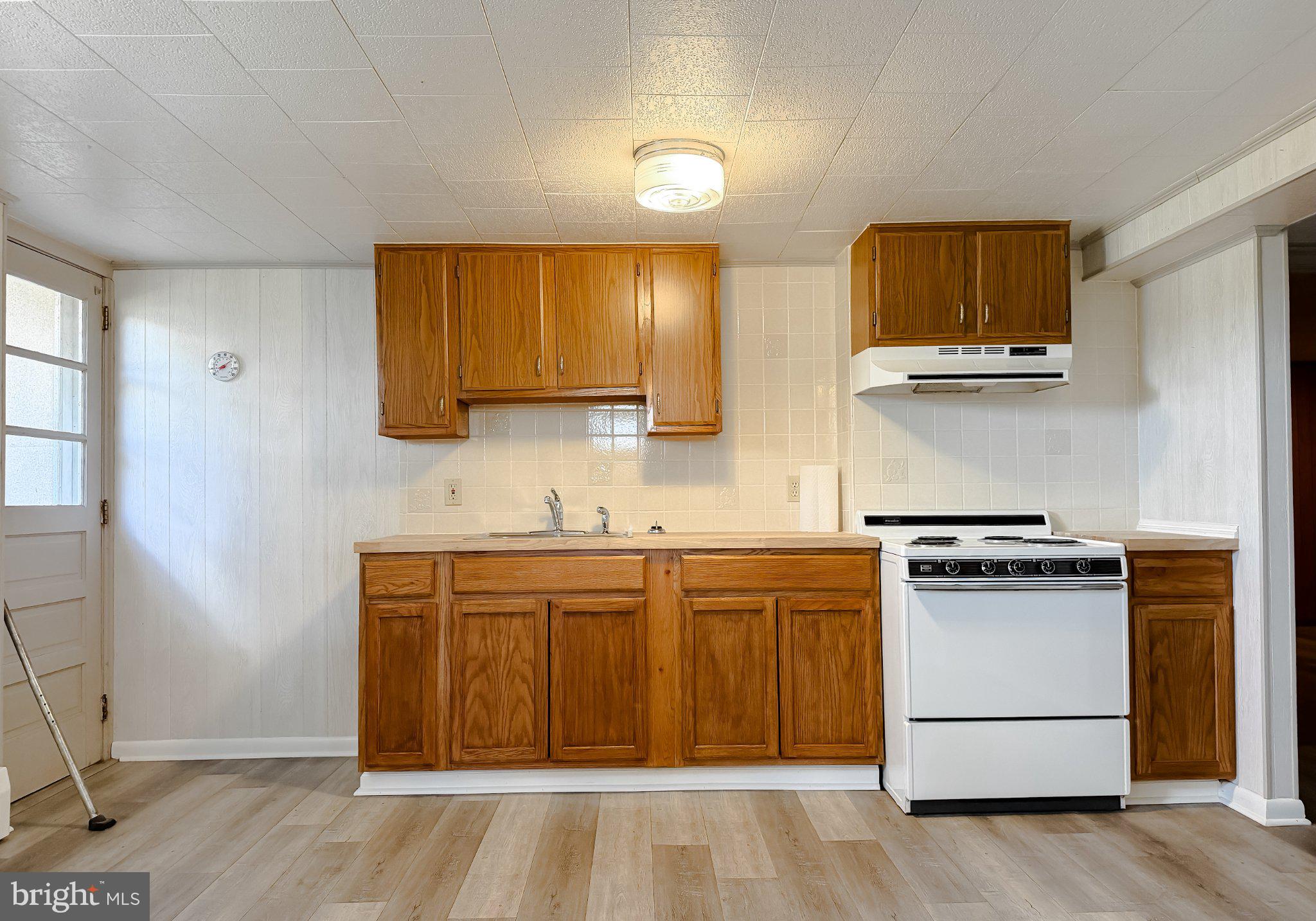 23230 Colton Point Road Avenue, MD 20609 - Photo 43 of 63 Cozy kitchen with warm wooden tones.