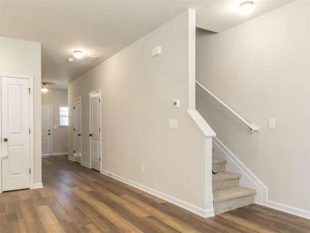 a view of entryway with wooden floor