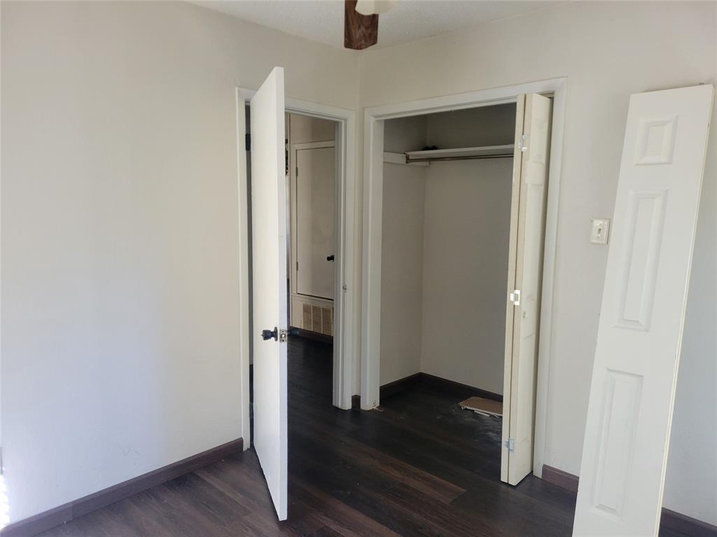 106 Allen Street Arp, TX 75750 - Photo 9 of 11 an empty room with wooden floor and closet