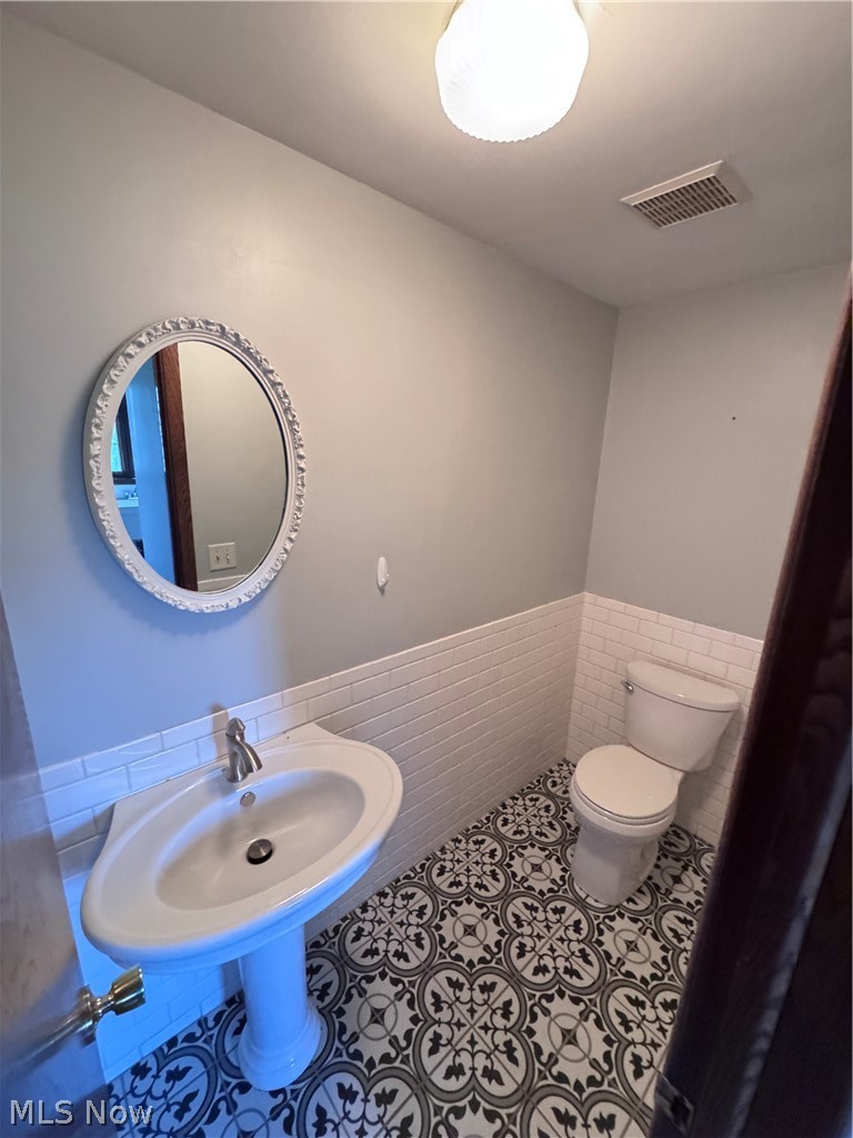8615 Eberhart Road Northwest Dover, OH 44622 - Photo 5 of 38 1/2 bath off garage/laundryroom
