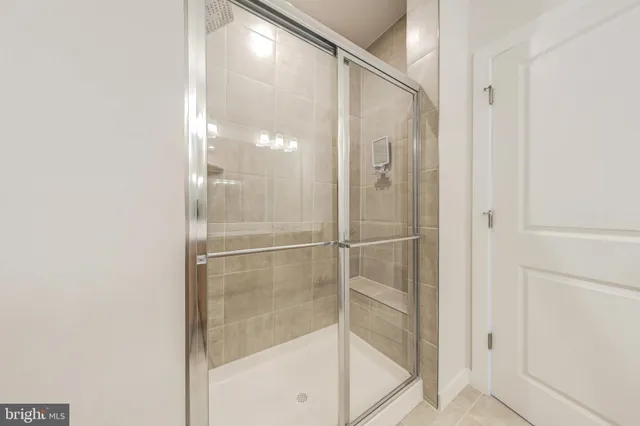 a bathroom with a glass shower door