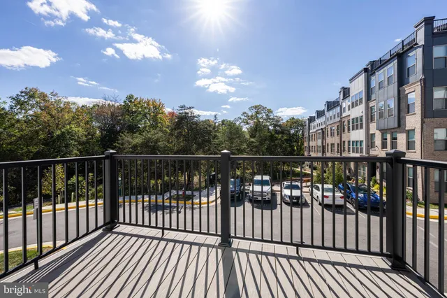 a view of a balcony with wooden floor