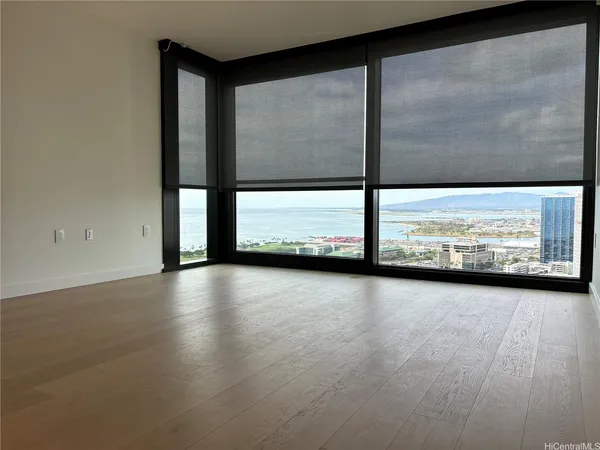a view of a glass room with floor to ceiling windows