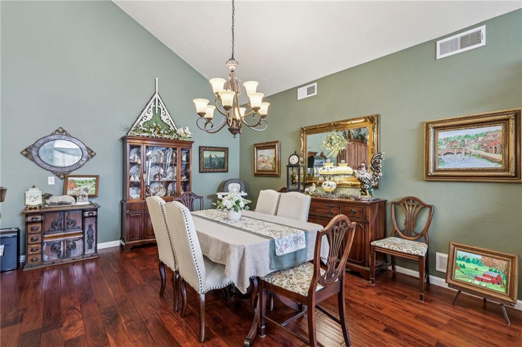 3377 Highway 982 Latrobe, PA 15650 - Photo 17 of 44 a view of a dining room with furniture wooden floor and chandelier