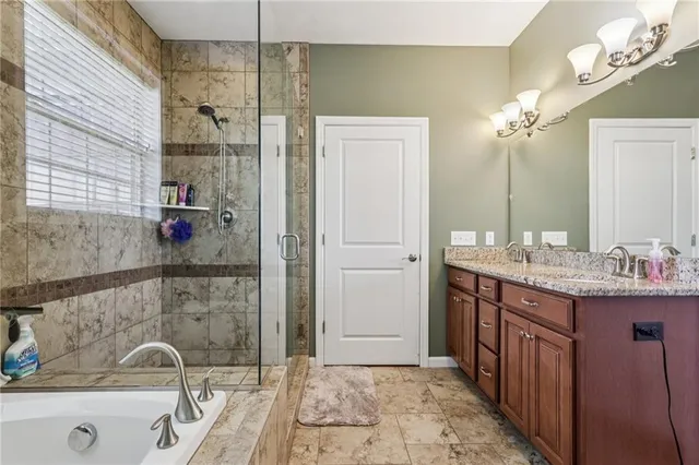 a bedroom with bed and wooden floor