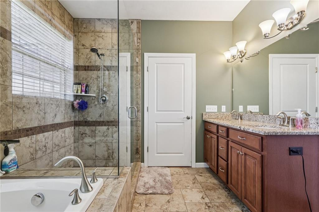 3377 Highway 982 Latrobe, PA 15650 - Photo 25 of 44 a bathroom with a granite countertop sink a mirror and shower