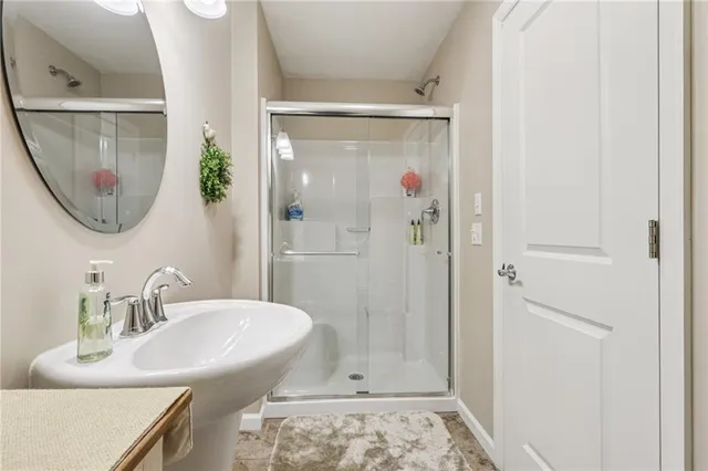 a kitchen with a sink a stove and cabinets