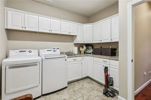 a bed room with a bed and a chandelier