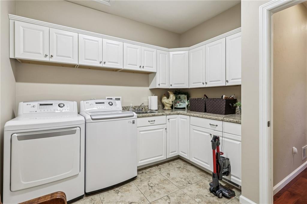 3377 Highway 982 Latrobe, PA 15650 - Photo 29 of 44 a kitchen with a sink a stove and cabinets