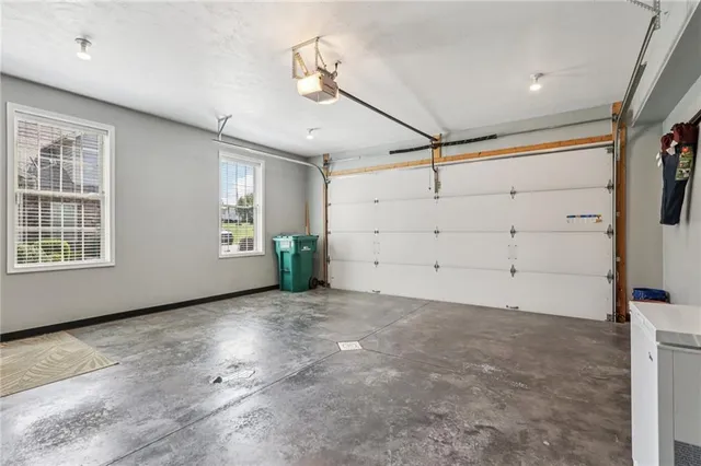 a view of a livingroom with a space and a ceiling fan