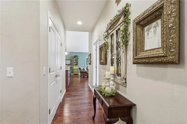 a living room with furniture a fireplace and a large window