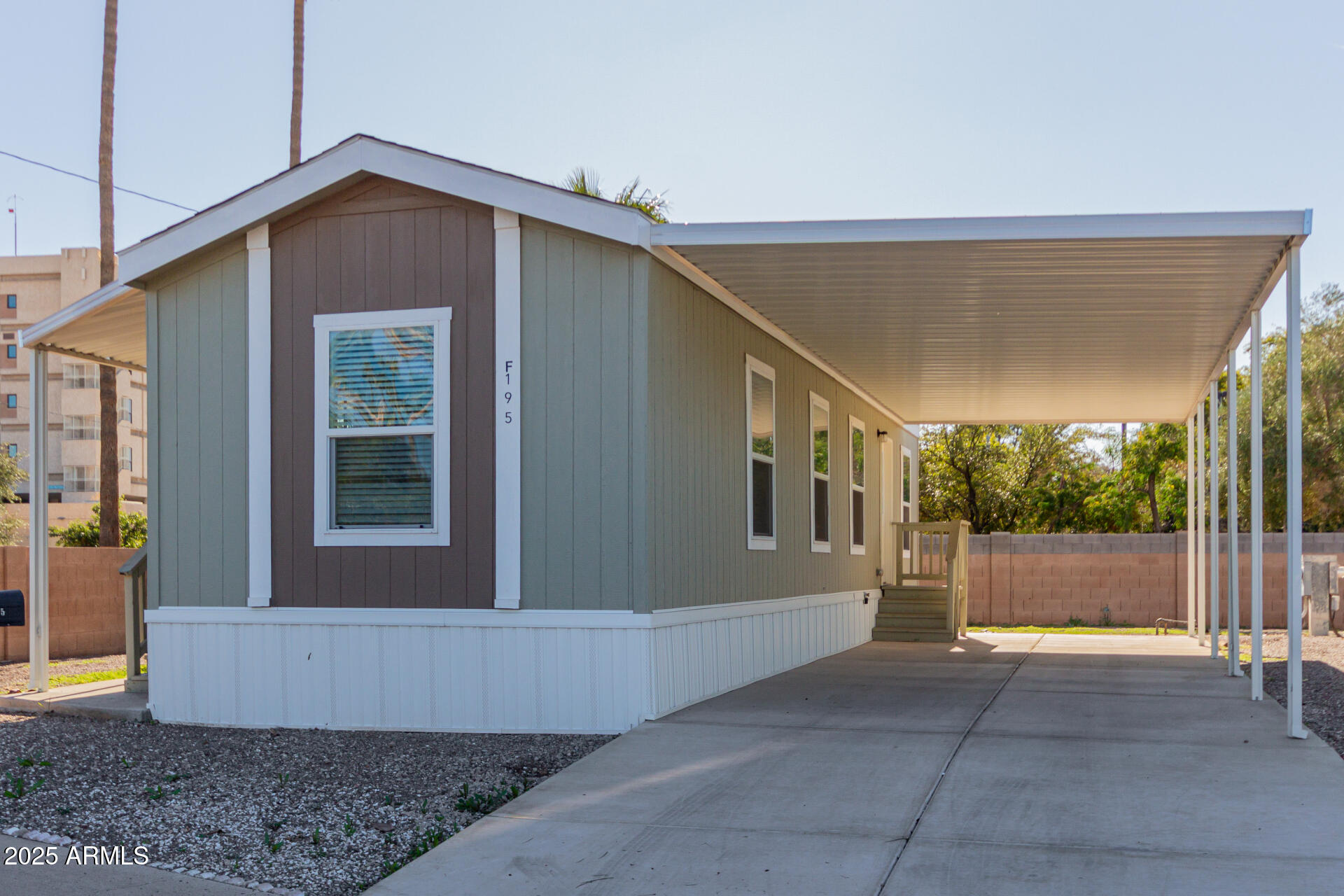 5201 West Camelback Road, Unit F195 Phoenix, AZ 85031 - Photo 1 of 13 a view of a house with a backyard