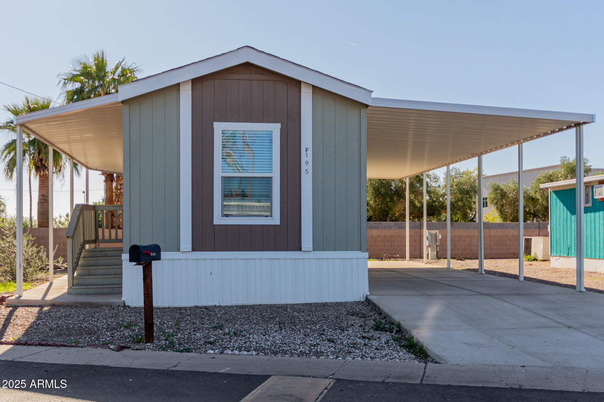 5201 West Camelback Road, Unit F195 Phoenix, AZ 85031 - Photo 2 of 13 a front view of a house with garden