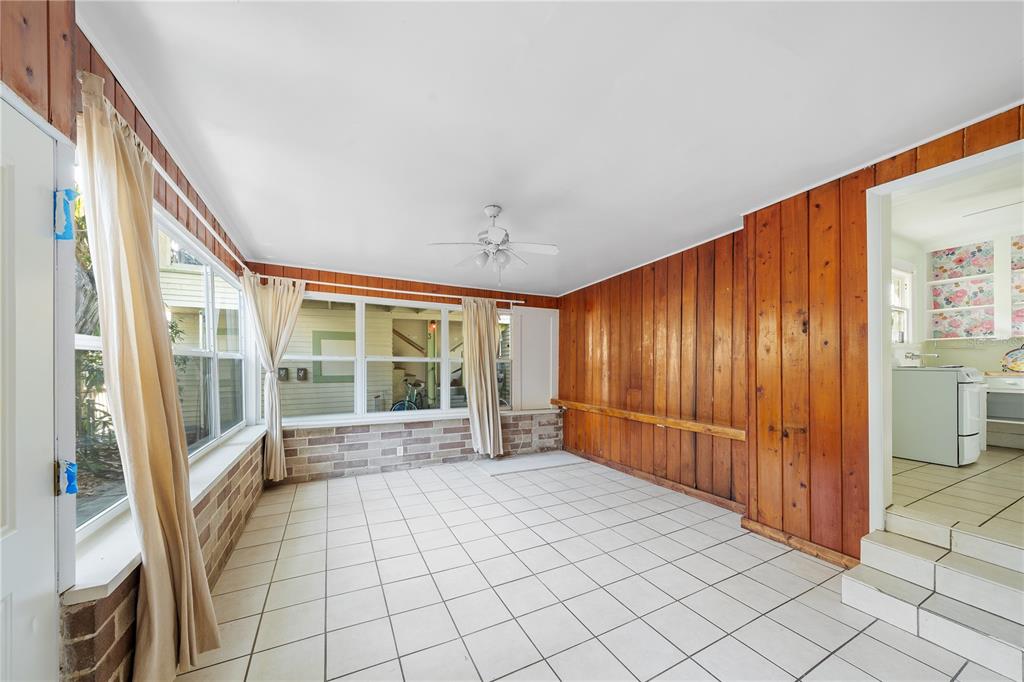 708 Grove Street North St. Petersburg, FL 33701 - Photo 3 of 13 a view of an entryway with wooden floor and windows