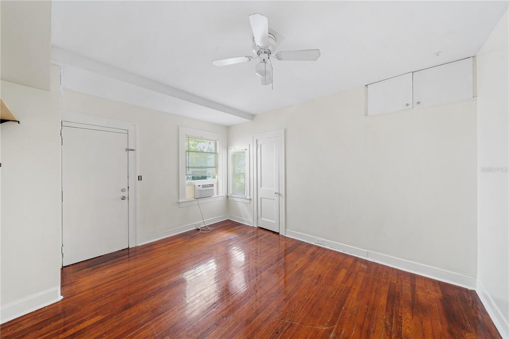 708 Grove Street North St. Petersburg, FL 33701 - Photo 6 of 13 a view of an empty room with wooden floor