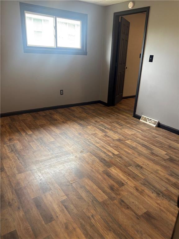 320 Beallsville Road Bentleyville, PA 15314 - Photo 16 of 26 an empty room with wooden floor and windows