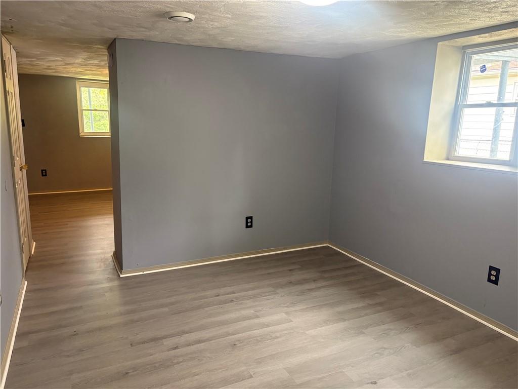 320 Beallsville Road Bentleyville, PA 15314 - Photo 21 of 26 an empty room with wooden floor and windows