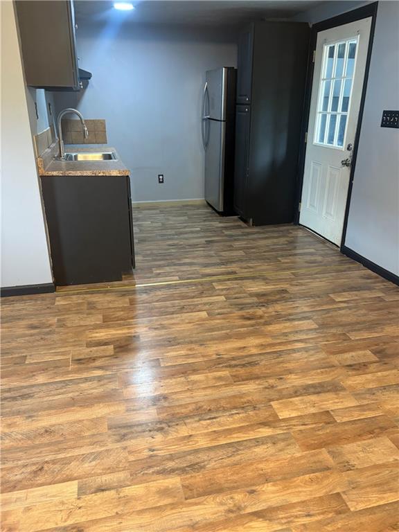 320 Beallsville Road Bentleyville, PA 15314 - Photo 8 of 26 a view of a kitchen with refrigerator and wooden floor